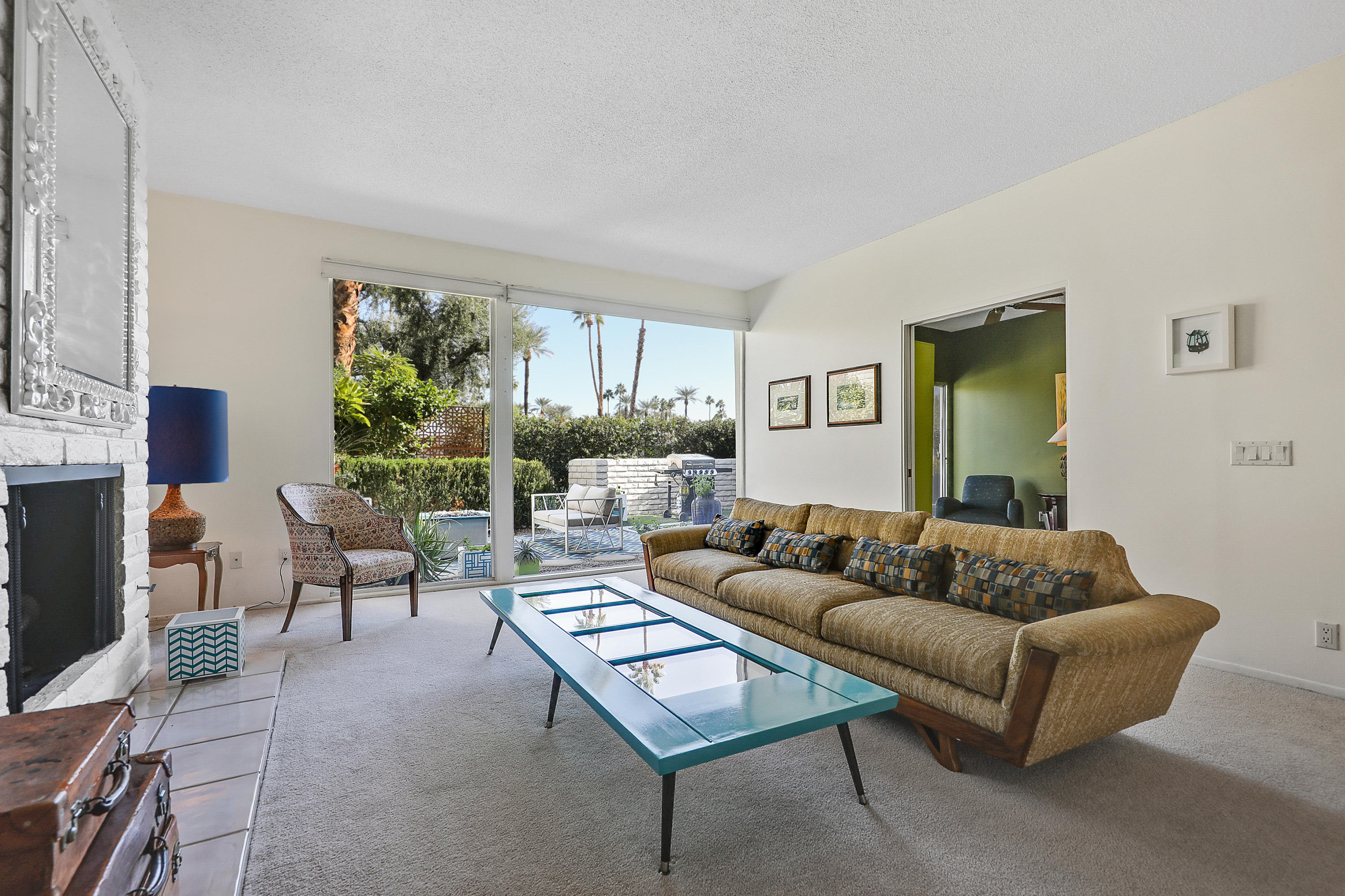 45204 Ave Codorniz Indian Wells, CA 92210 - Photo 6 of 36 a living room with furniture and a flat screen tv