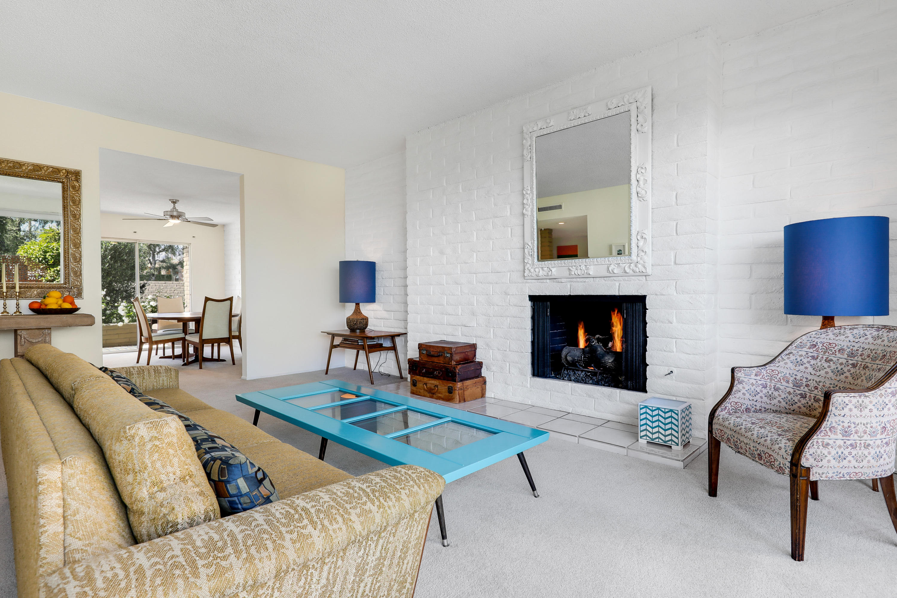 45204 Ave Codorniz Indian Wells, CA 92210 - Photo 7 of 36 a living room with furniture and a fireplace