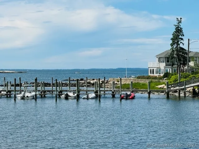 a group of people sitting in a big yard