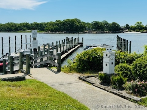 15 Griswold Road East Lyme, CT 06357 - Photo 14 of 16 a view of a lake with a building in the background