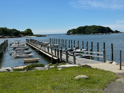 15 Griswold Road East Lyme, CT 06357 - Photo 15 of 16 a view of a patio with chairs next to a yard