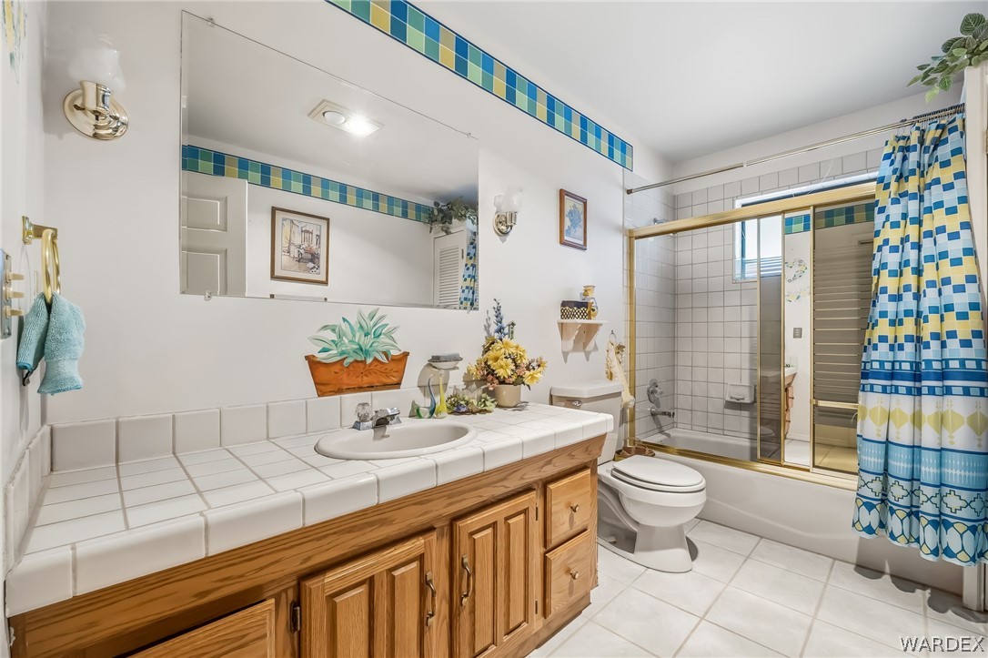 2401 North Stephan Road Kingman, AZ 86401 - Photo 45 of 92 a bathroom with a sink a toilet and shower