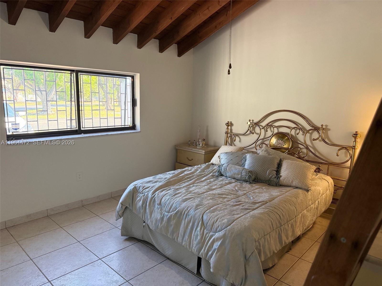 2500 Southwest 122nd Court Miami, FL 33175 - Photo 11 of 19 a bedroom with a bed and window
