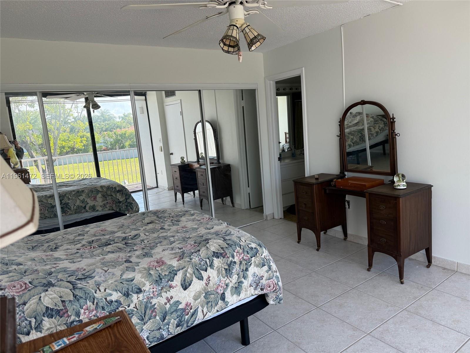 2500 Southwest 122nd Court Miami, FL 33175 - Photo 15 of 19 a bedroom with a bed and a large window