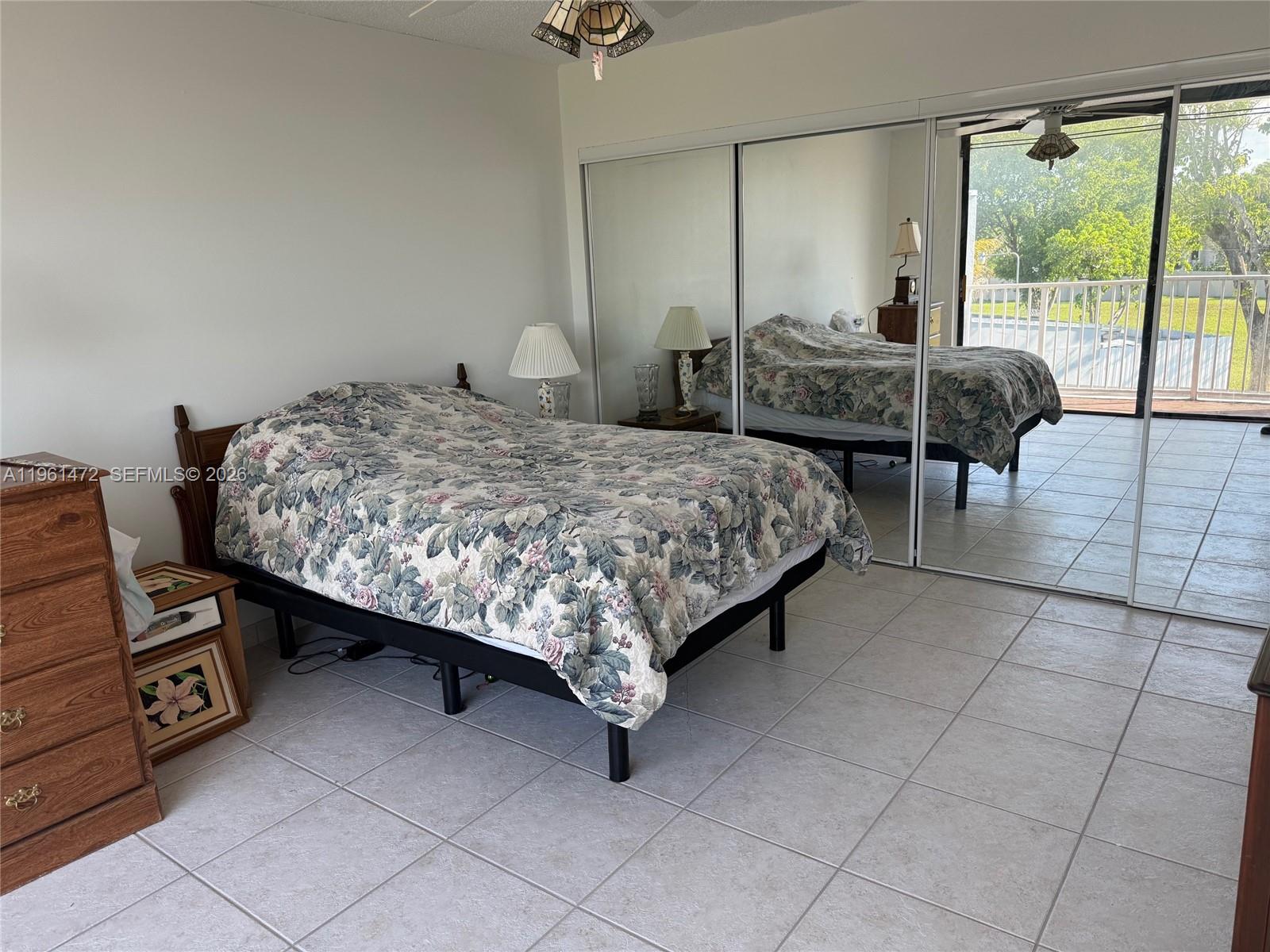 2500 Southwest 122nd Court Miami, FL 33175 - Photo 16 of 19 a bedroom with a bed a table and chair