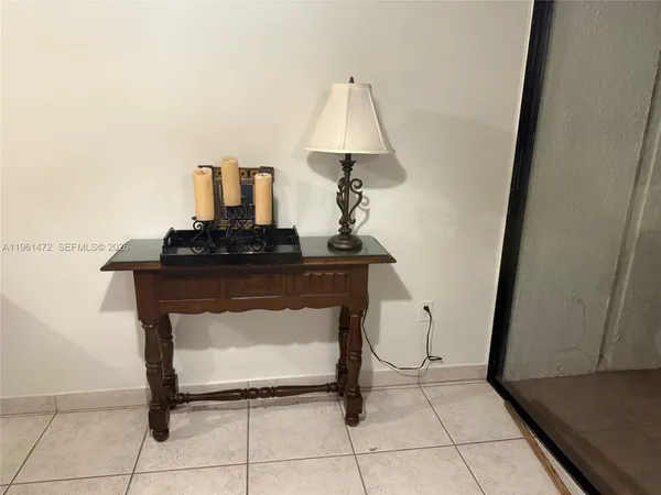 a room with a sink and a mirror