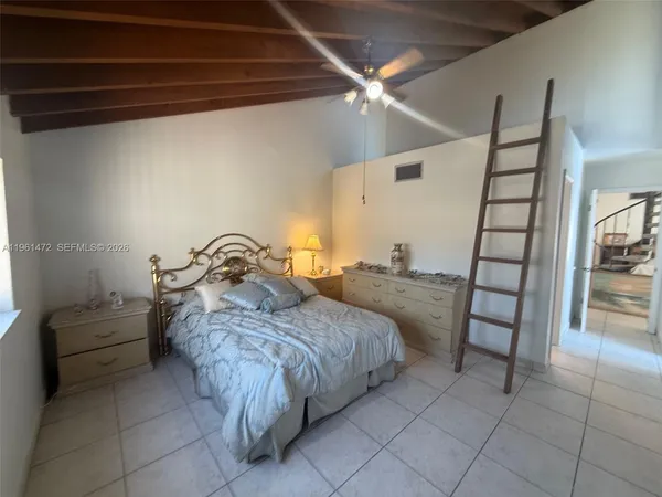 a bed room with a bed and a couch