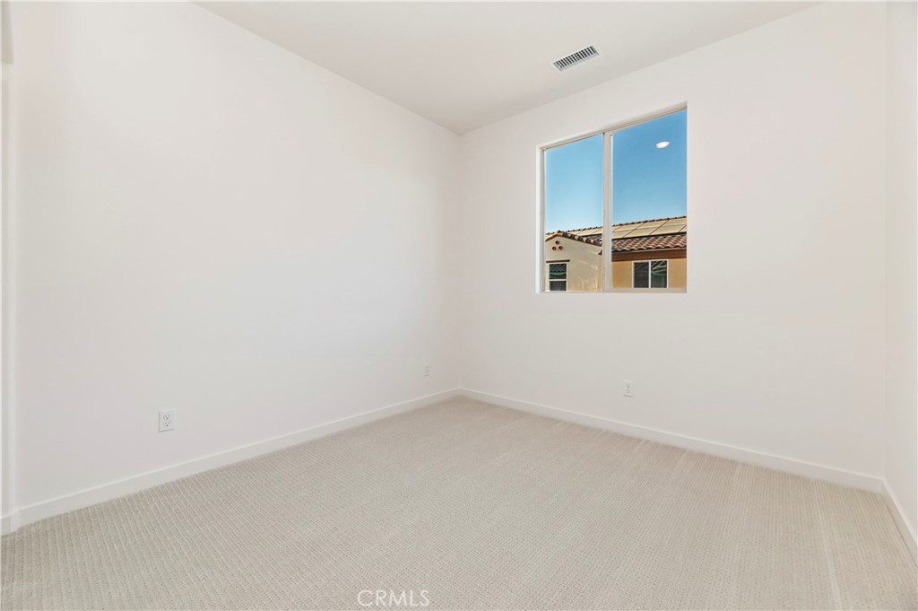 3975 Lavine Way Corona, CA 92883 - Photo 12 of 24 an empty room with a window