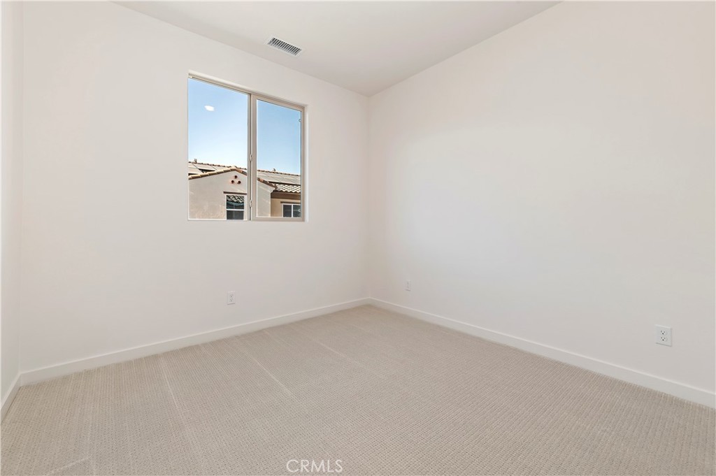 3975 Lavine Way Corona, CA 92883 - Photo 13 of 24 an empty room with a window