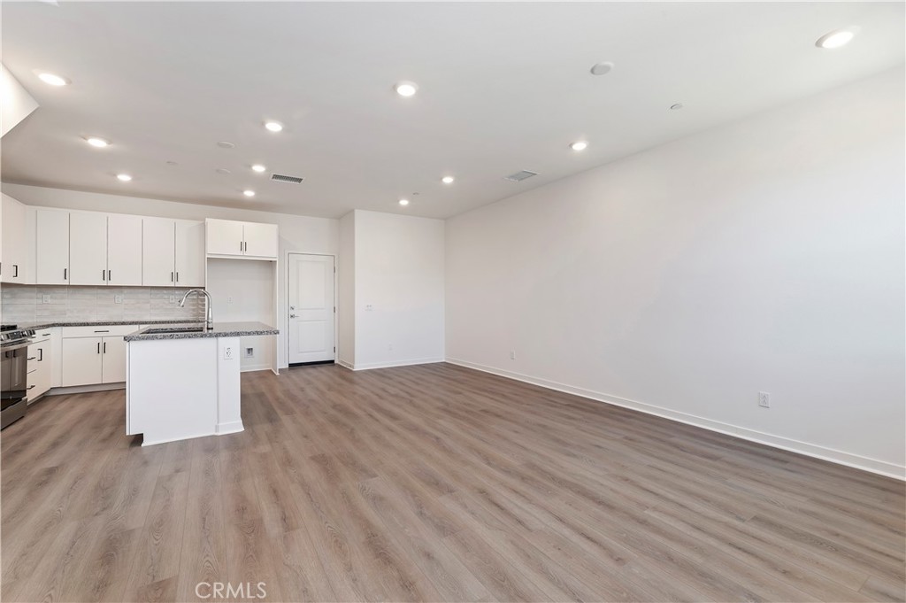 3975 Lavine Way Corona, CA 92883 - Photo 3 of 24 a view of kitchen with wooden floor