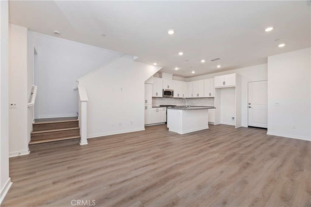 3975 Lavine Way Corona, CA 92883 - Photo 5 of 24 a view of kitchen with wooden floor and electronic appliances