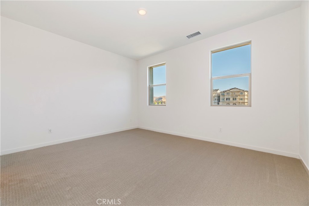 3975 Lavine Way Corona, CA 92883 - Photo 10 of 24 an empty room with a window