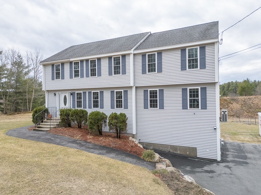 78 Mason Road Townsend, MA 01474 - Photo 1 of 42 a front view of a house with a yard