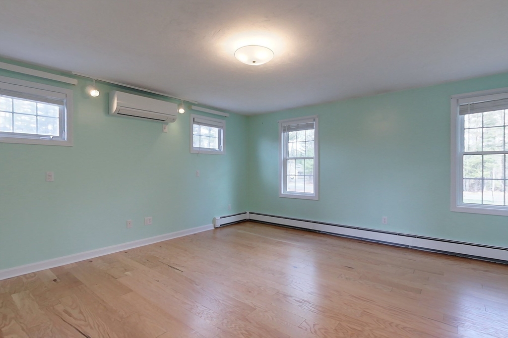 78 Mason Road Townsend, MA 01474 - Photo 19 of 42 an empty room with wooden floor and windows