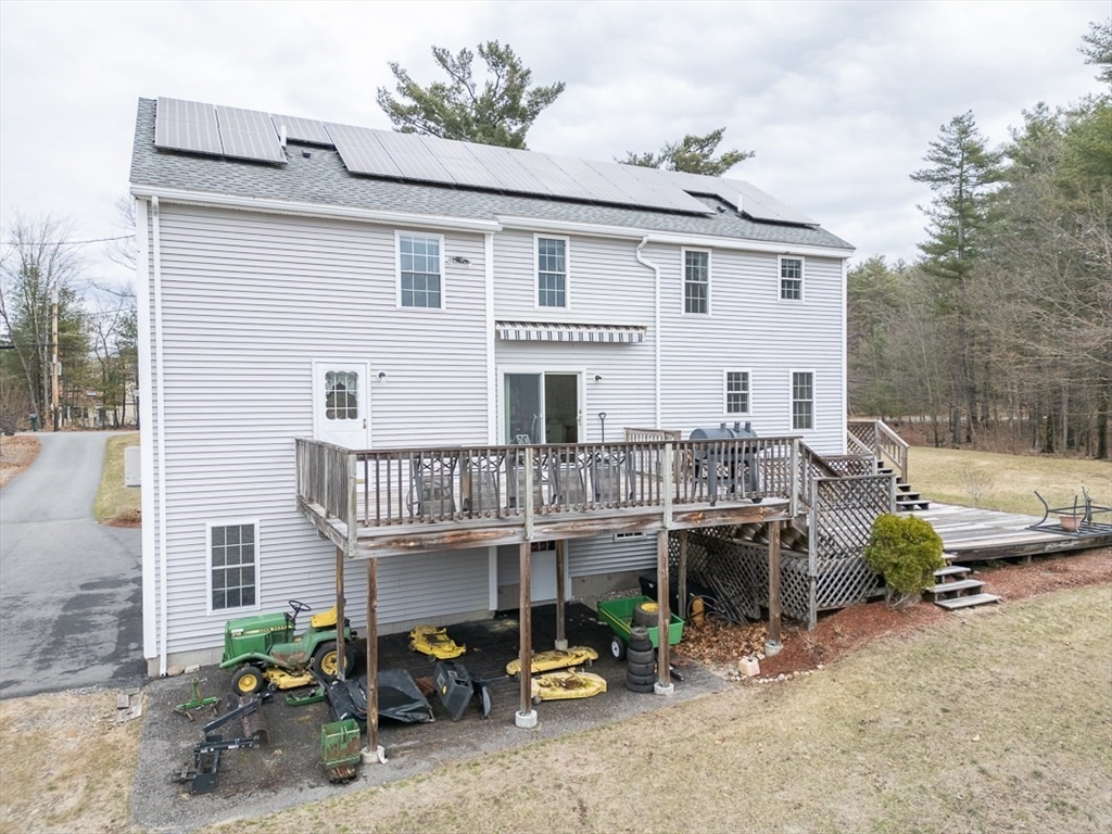 78 Mason Road Townsend, MA 01474 - Photo 2 of 42 a view of a patio with furniture and a fire pit