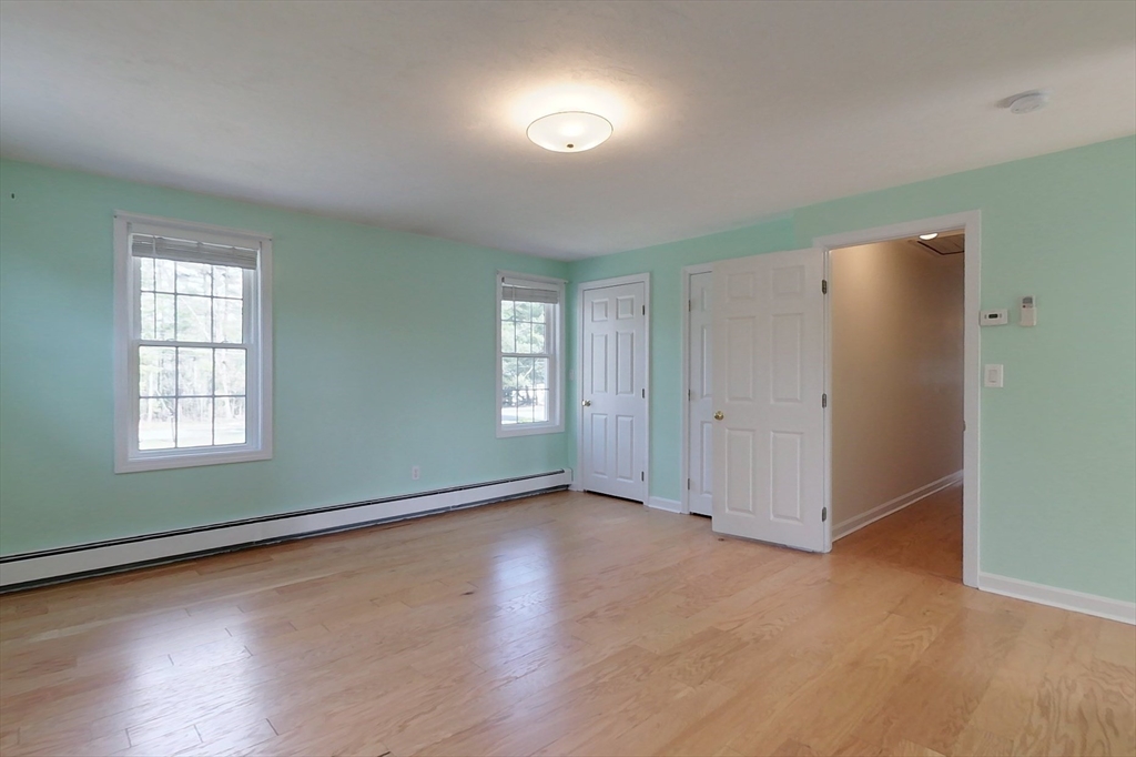 78 Mason Road Townsend, MA 01474 - Photo 22 of 42 an empty room with wooden floor and windows