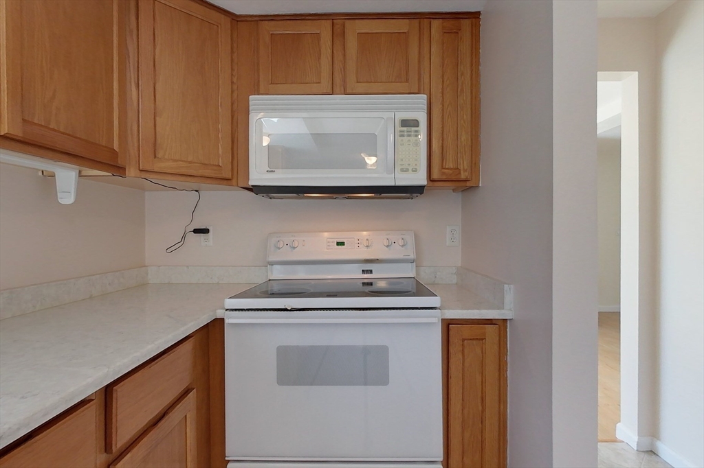 78 Mason Road Townsend, MA 01474 - Photo 4 of 42 a kitchen with a stove and a microwave