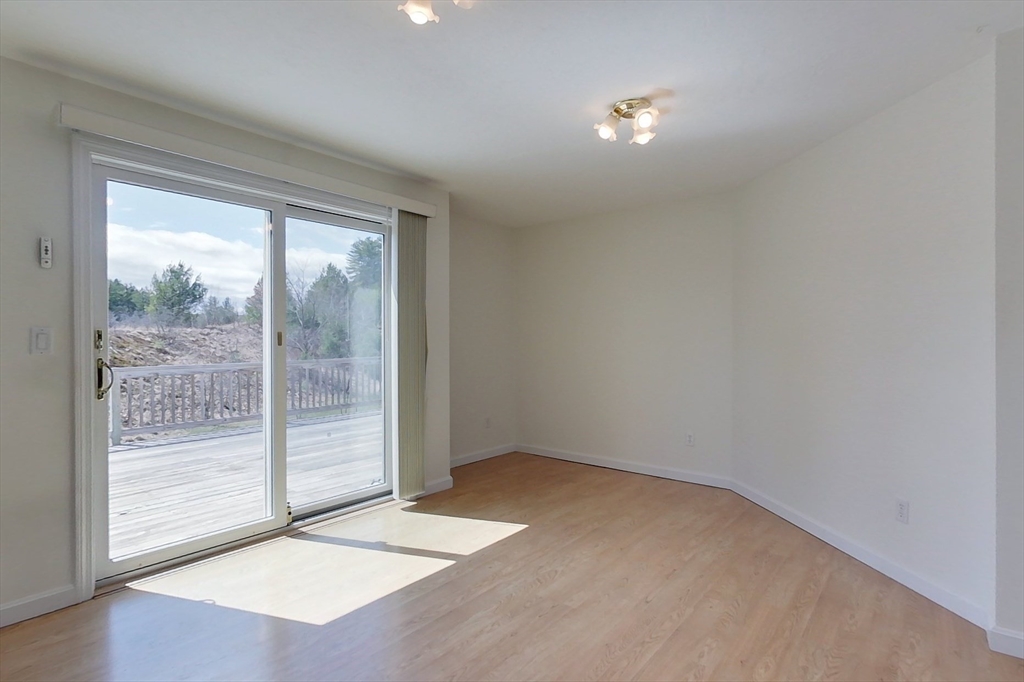 78 Mason Road Townsend, MA 01474 - Photo 7 of 42 a view of an empty room with wooden floor and a window