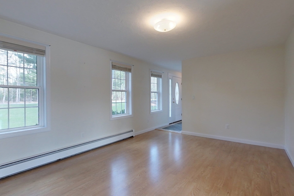 78 Mason Road Townsend, MA 01474 - Photo 10 of 42 an empty room with wooden floor and windows