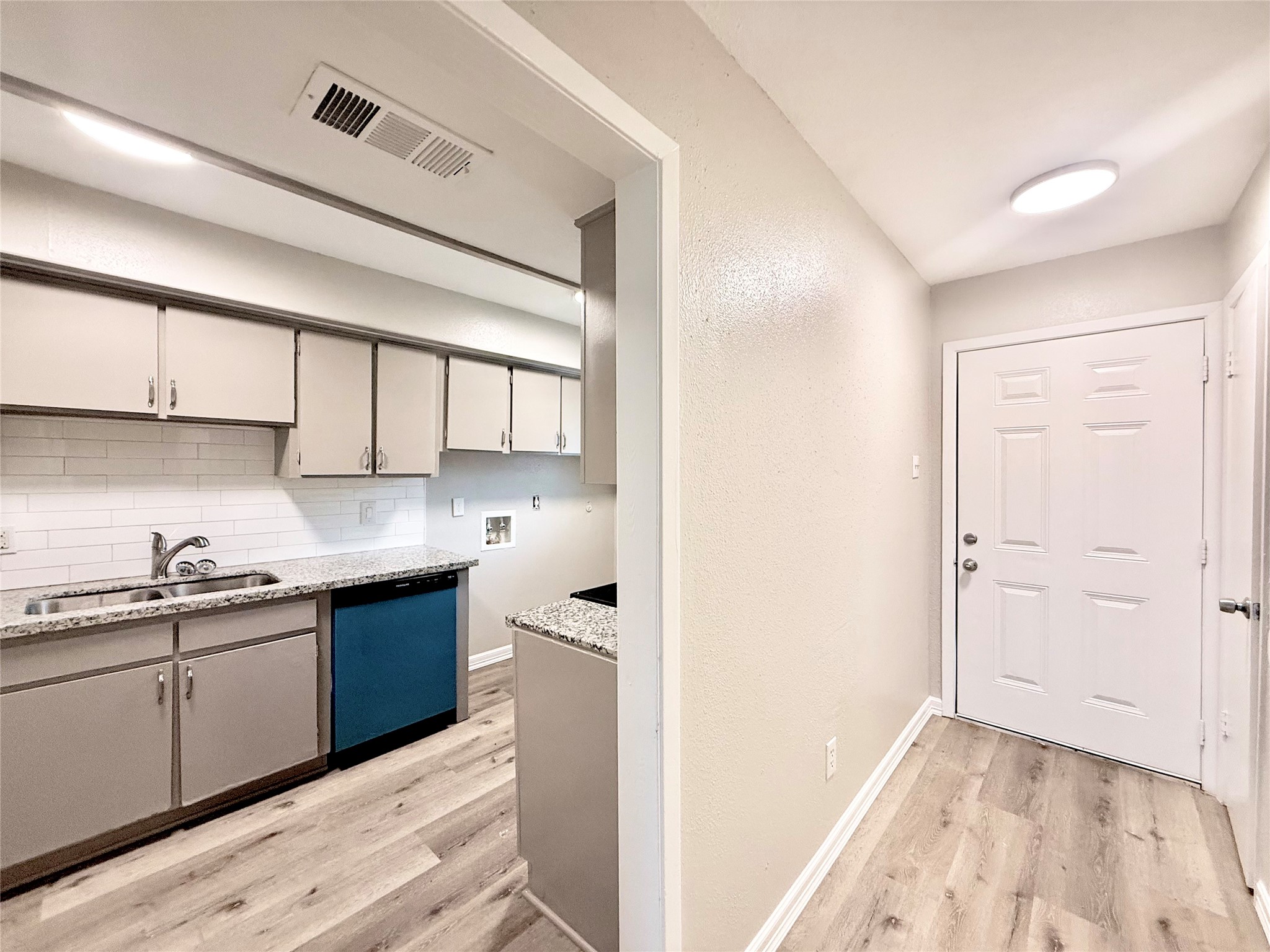 7980 Grove Ridge Drive Houston, TX 77061 - Photo 4 of 19 Entry and Kitchen
