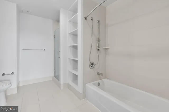 a bathroom with a bathtub and a shower