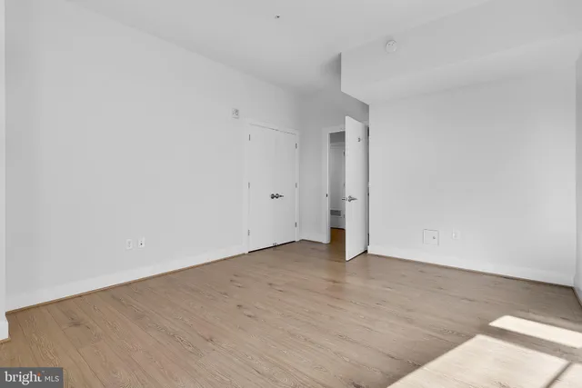 an empty room with wooden floor