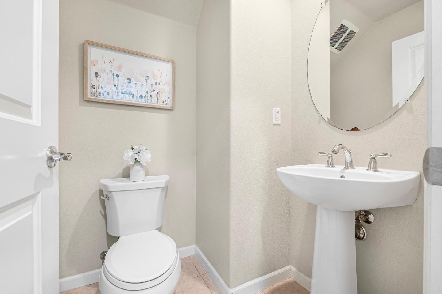 719 Raines Terrace Sunnyvale, CA 94087 - Photo 12 of 47 a bathroom with a toilet sink and mirror