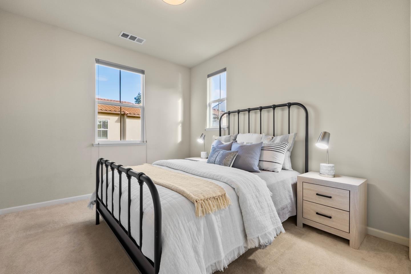 719 Raines Terrace Sunnyvale, CA 94087 - Photo 20 of 47 a bedroom with a bed and a window