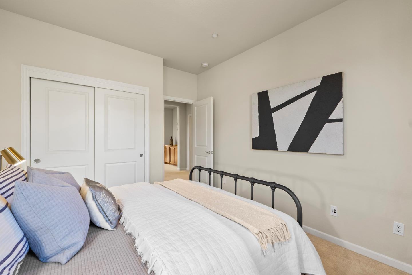 719 Raines Terrace Sunnyvale, CA 94087 - Photo 22 of 47 a bedroom with a bed and a painting on the wall