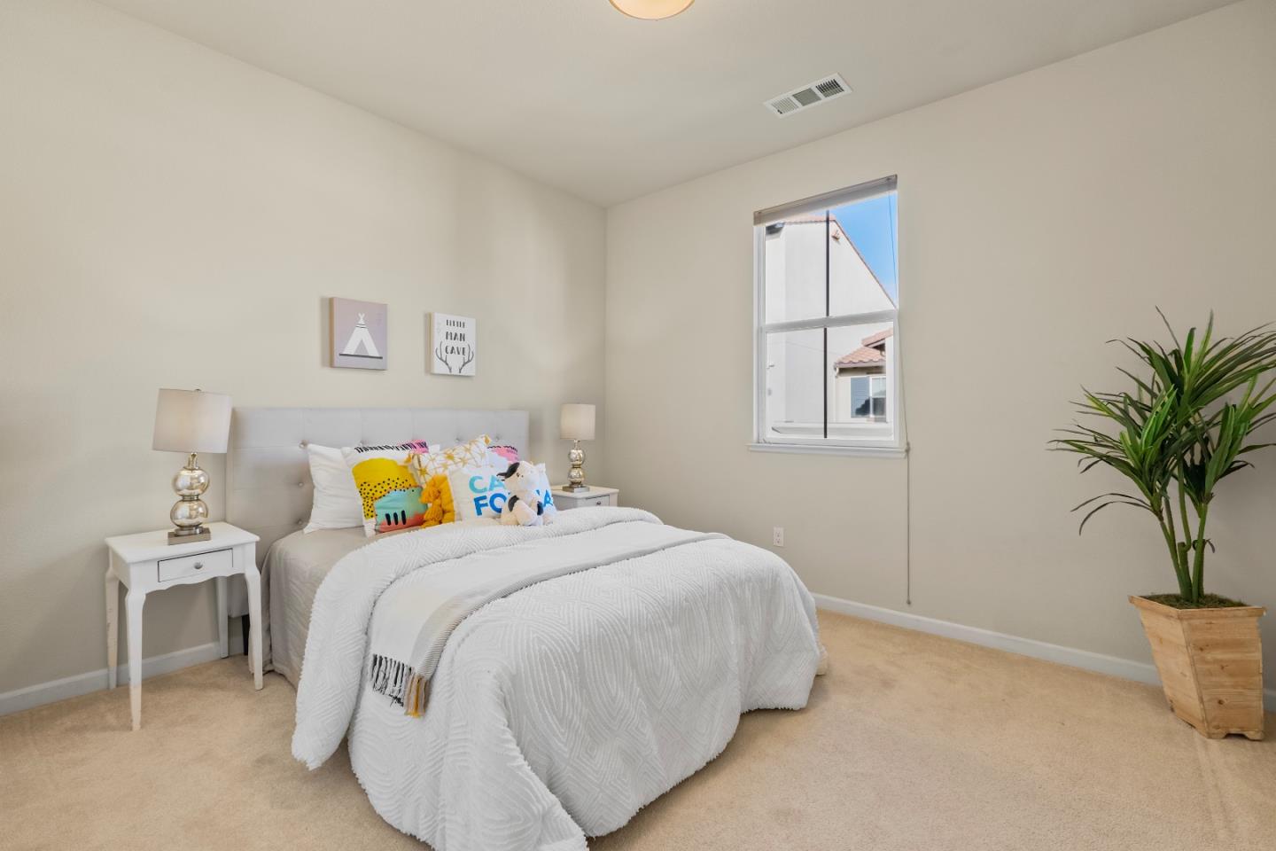 719 Raines Terrace Sunnyvale, CA 94087 - Photo 23 of 47 a bedroom with a bed and a window