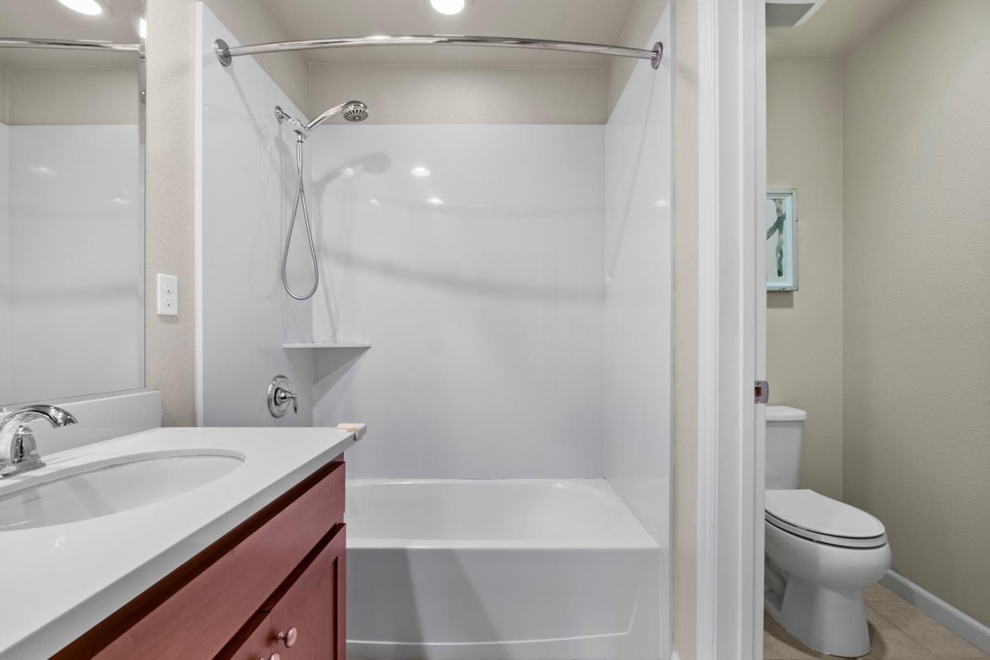 719 Raines Terrace Sunnyvale, CA 94087 - Photo 26 of 47 a bathroom with a granite countertop sink toilet and shower