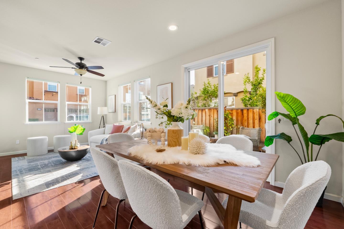 719 Raines Terrace Sunnyvale, CA 94087 - Photo 7 of 47 a dining room with furniture potted plants and wooden floor