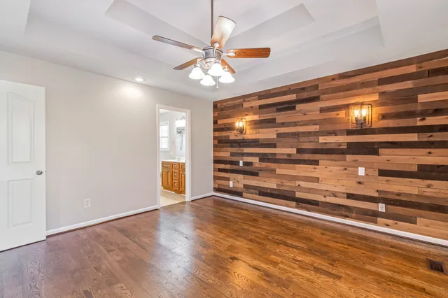 a view of room with window and ceiling fan