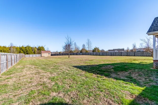 a view of a field with a big yard
