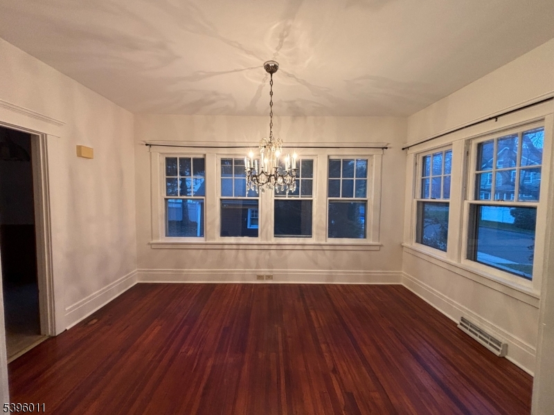 2 Beech Street Cranford, NJ 07016 - Photo 7 of 12 a view of wooden floor windows and chandelier in a room
