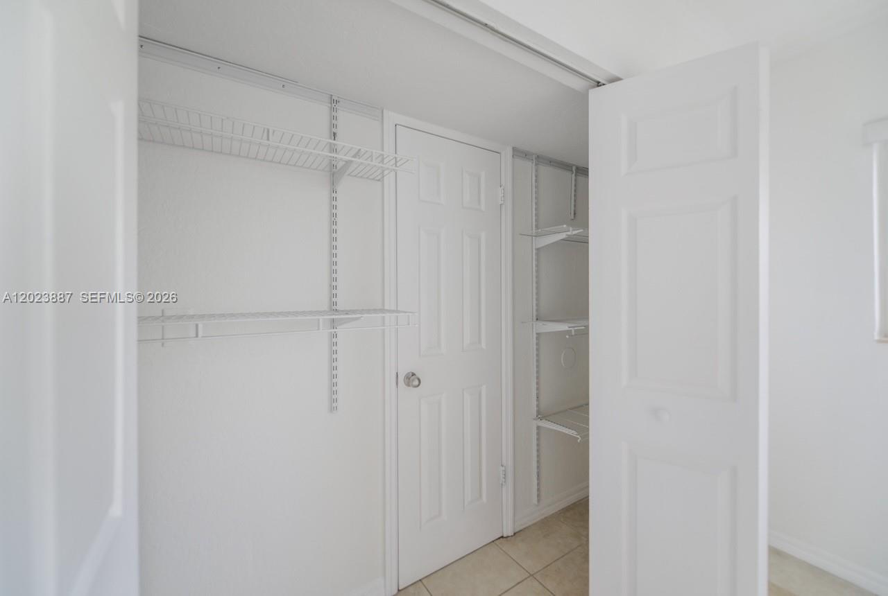 7737 Southwest 88th Street, Unit C312 Miami, FL 33156 - Photo 18 of 32 a view of closet area