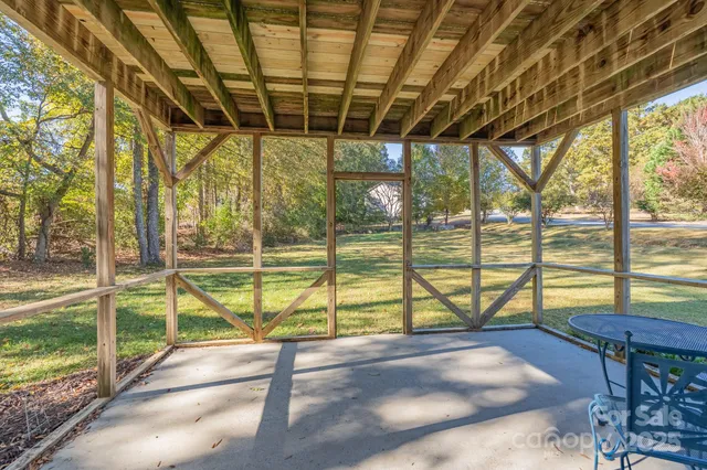 a view of a swimming pool with a porch