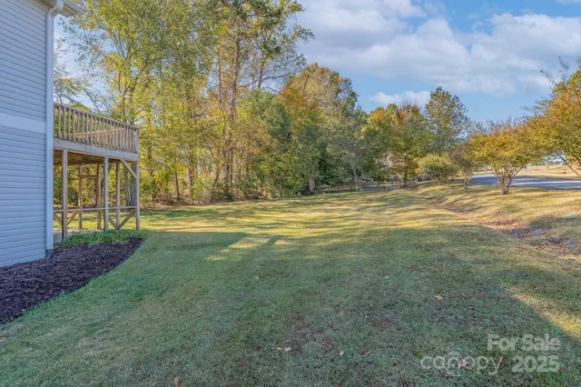 a view of outdoor space with garden and trees