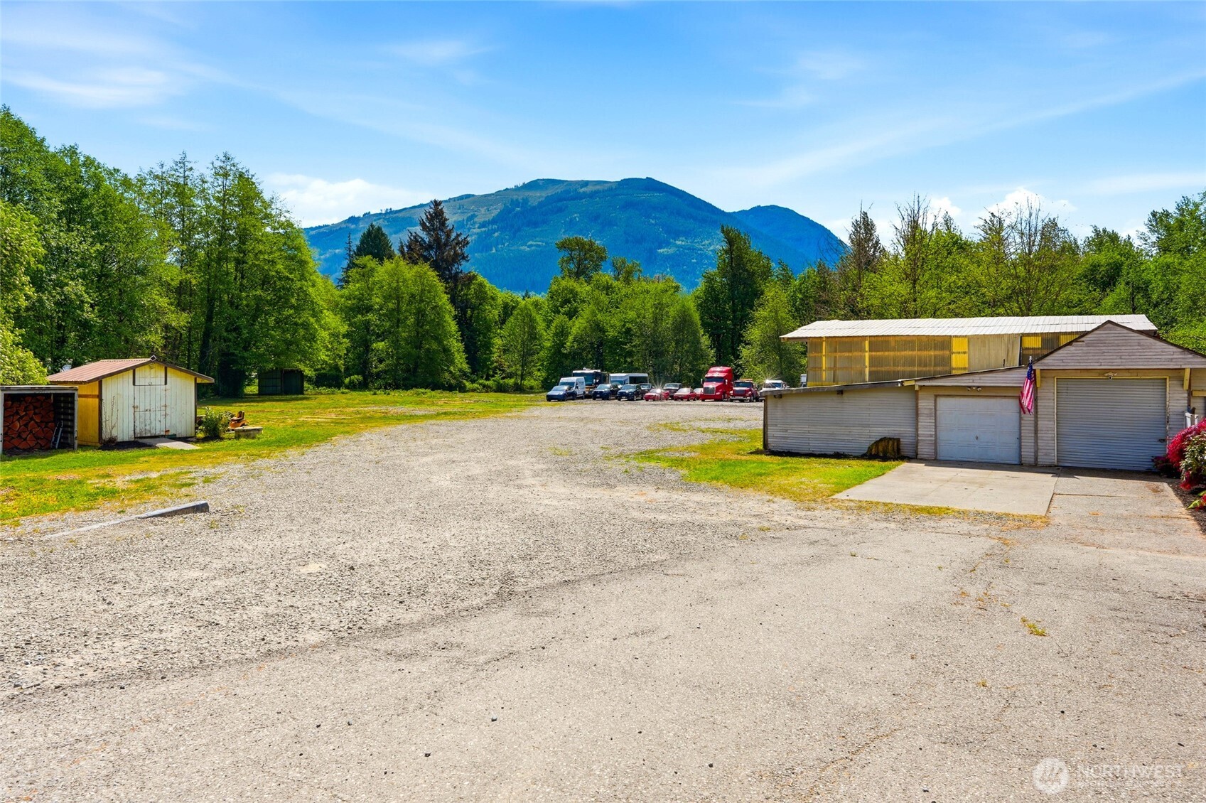 21716 State Rte 530 Northeast Arlington, WA 98223 - Photo 27 of 38 a view of a swimming pool with a patio and a yard