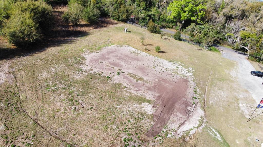 1043 Hazen Road DeLand, FL 32720 - Photo 13 of 16 a view of a dry yard with trees