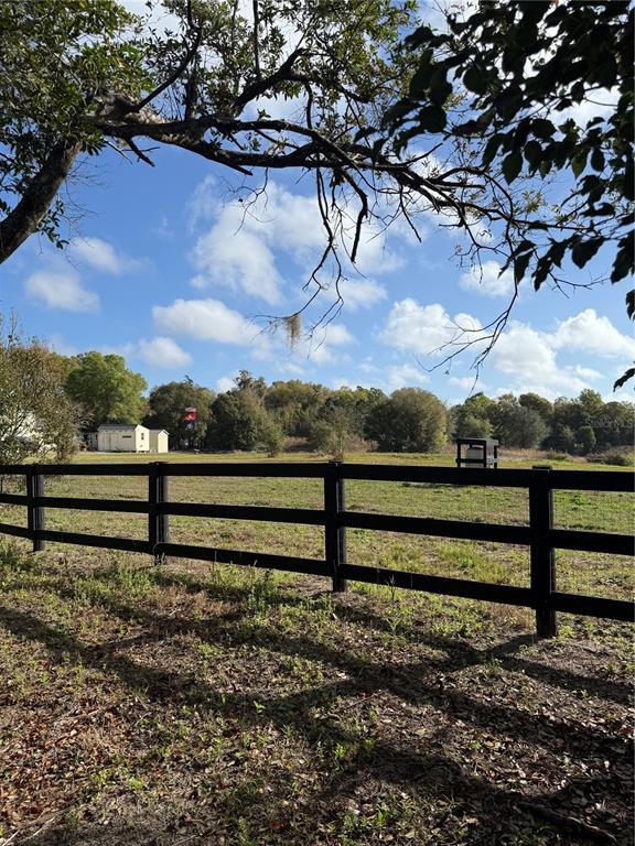 1043 Hazen Road DeLand, FL 32720 - Photo 2 of 16 a view of a yard with wooden fence