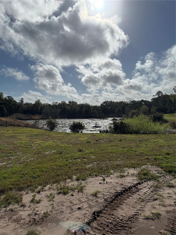 1043 Hazen Road DeLand, FL 32720 - Photo 9 of 16 a view of a lake view with houses in the background