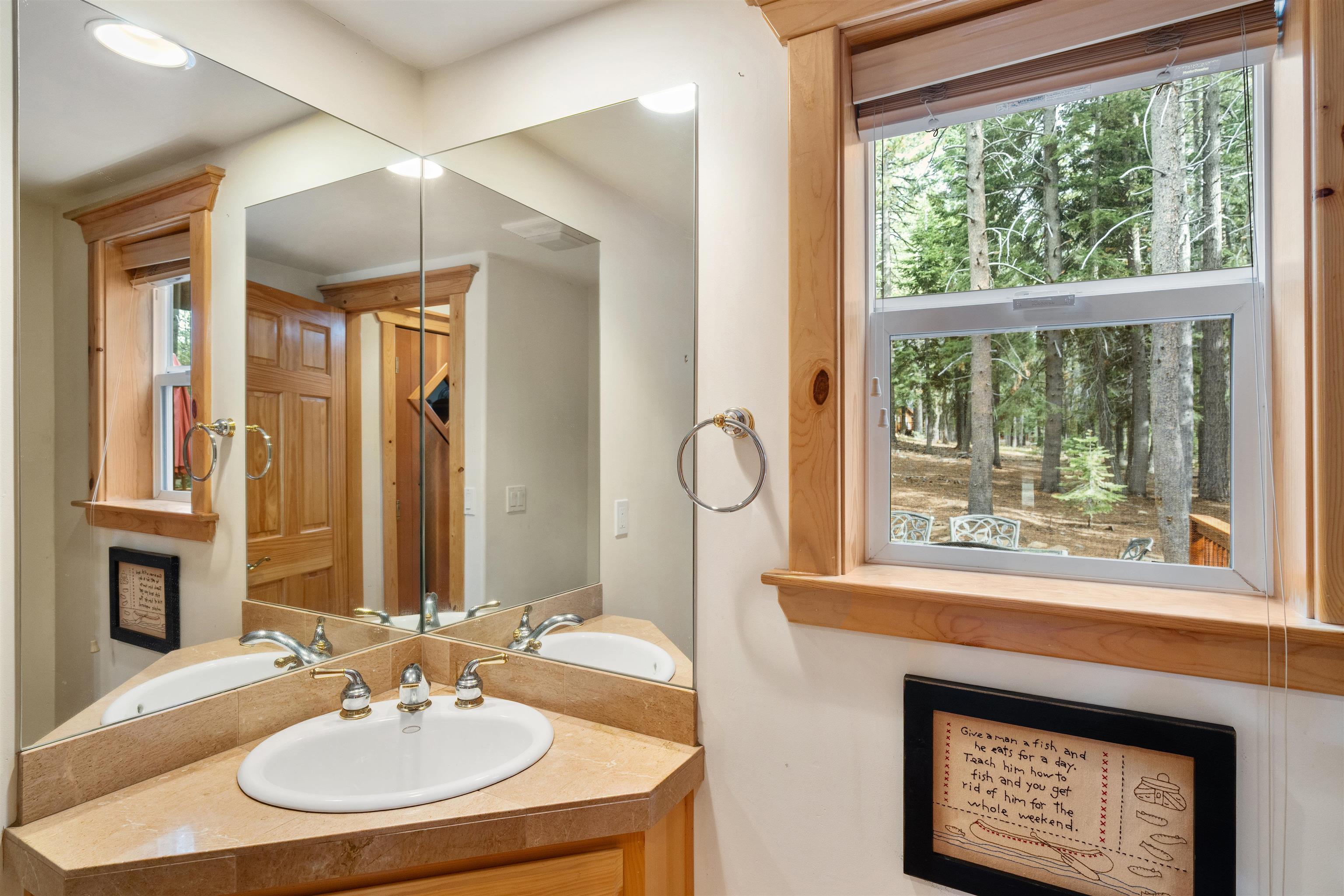 12851 Ski View Loop Truckee, CA 96161 - Photo 13 of 28 a bathroom with a sink and a mirror