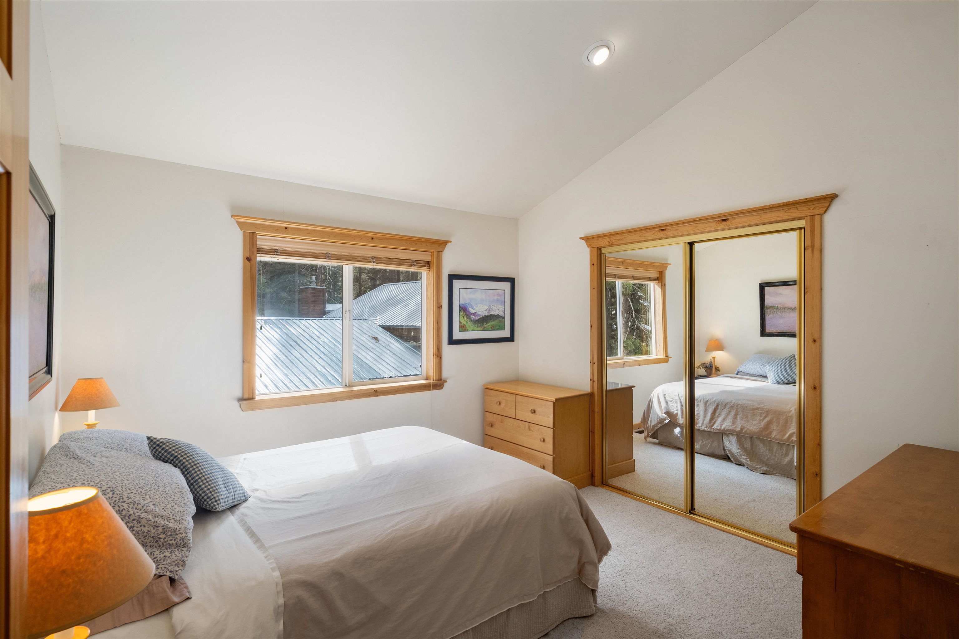 12851 Ski View Loop Truckee, CA 96161 - Photo 21 of 28 a bedroom with a bed and wooden floor