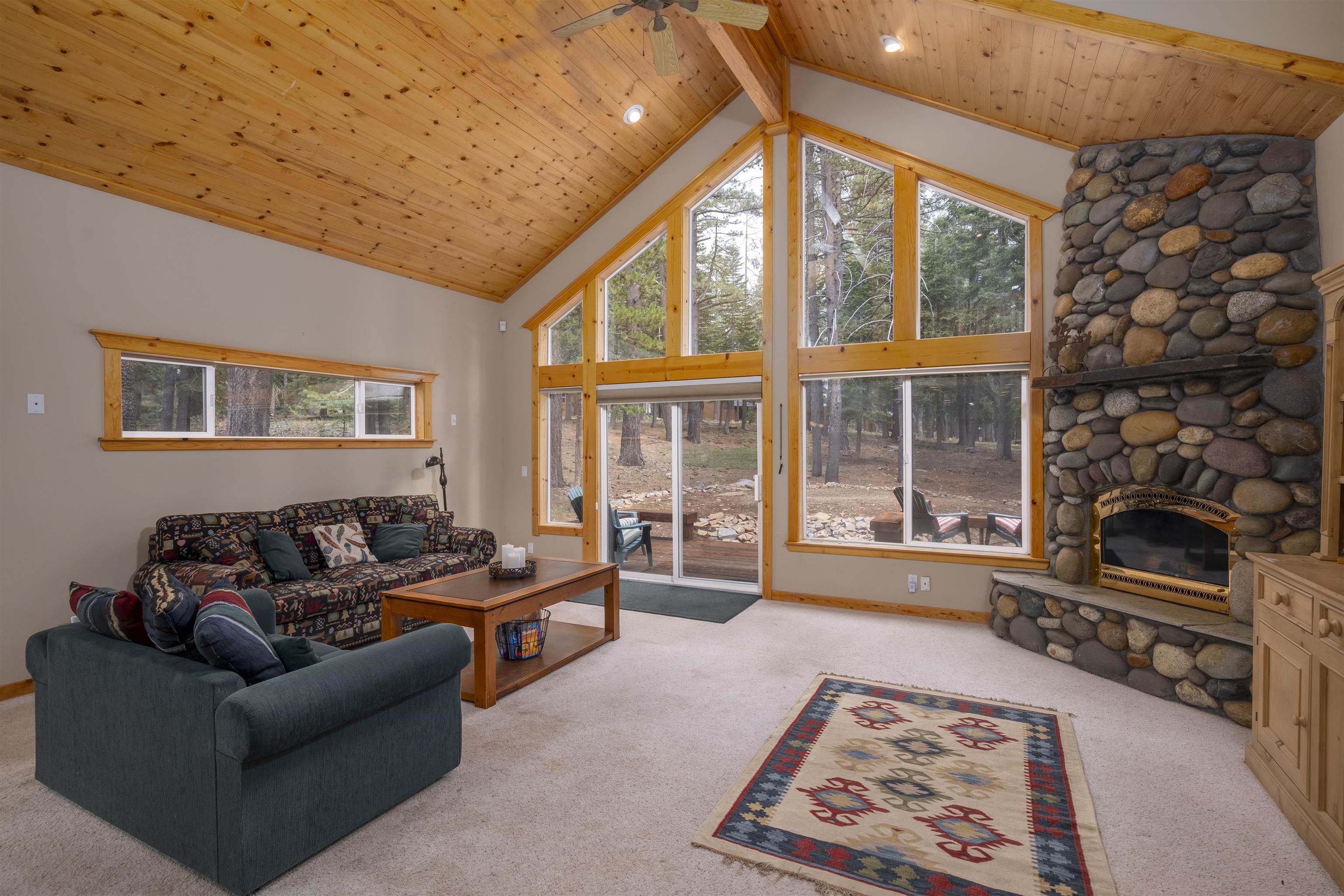 12851 Ski View Loop Truckee, CA 96161 - Photo 4 of 28 a living room with furniture and a fireplace