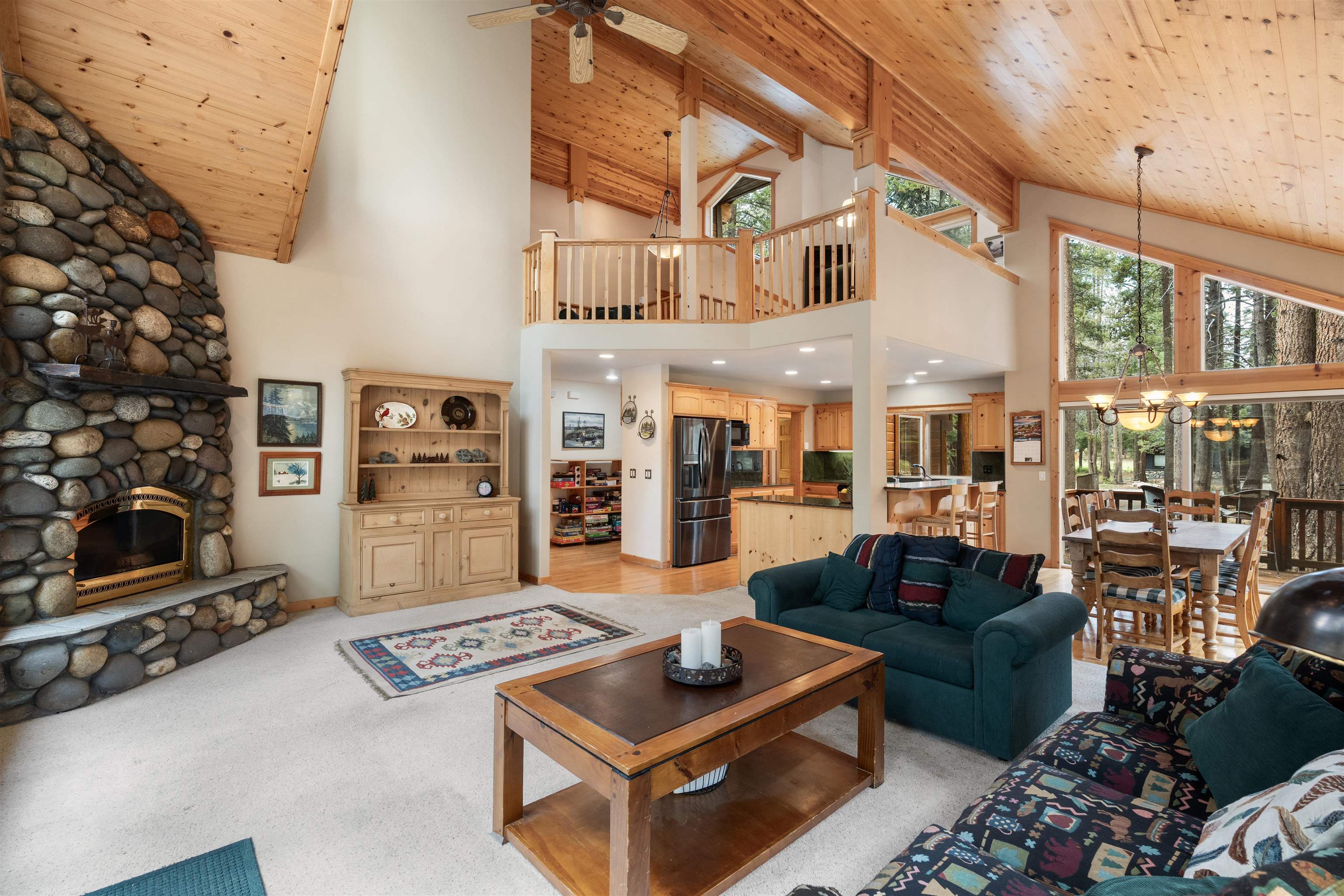 12851 Ski View Loop Truckee, CA 96161 - Photo 6 of 28 a living room with furniture a rug and a fireplace
