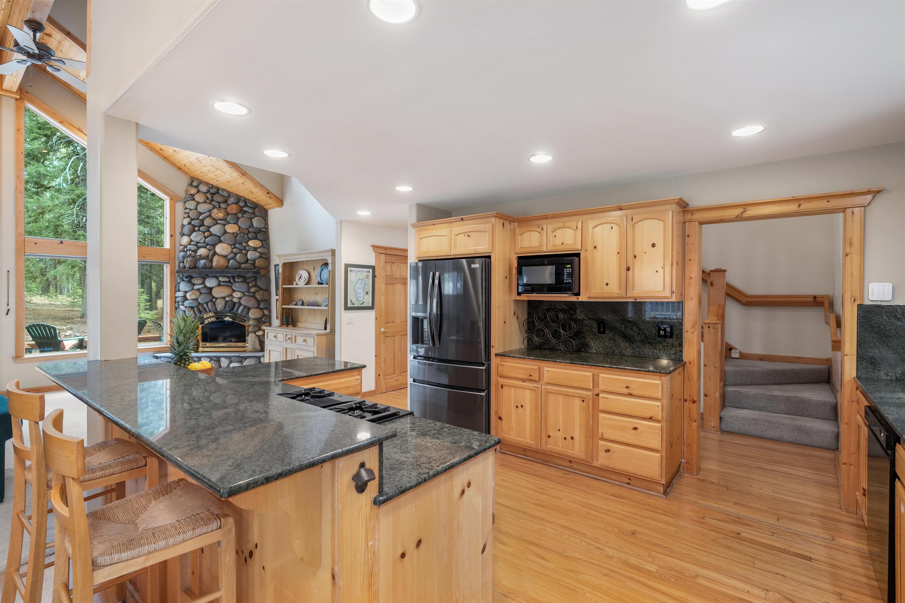 12851 Ski View Loop Truckee, CA 96161 - Photo 10 of 28 a kitchen with stainless steel appliances granite countertop a stove and a refrigerator