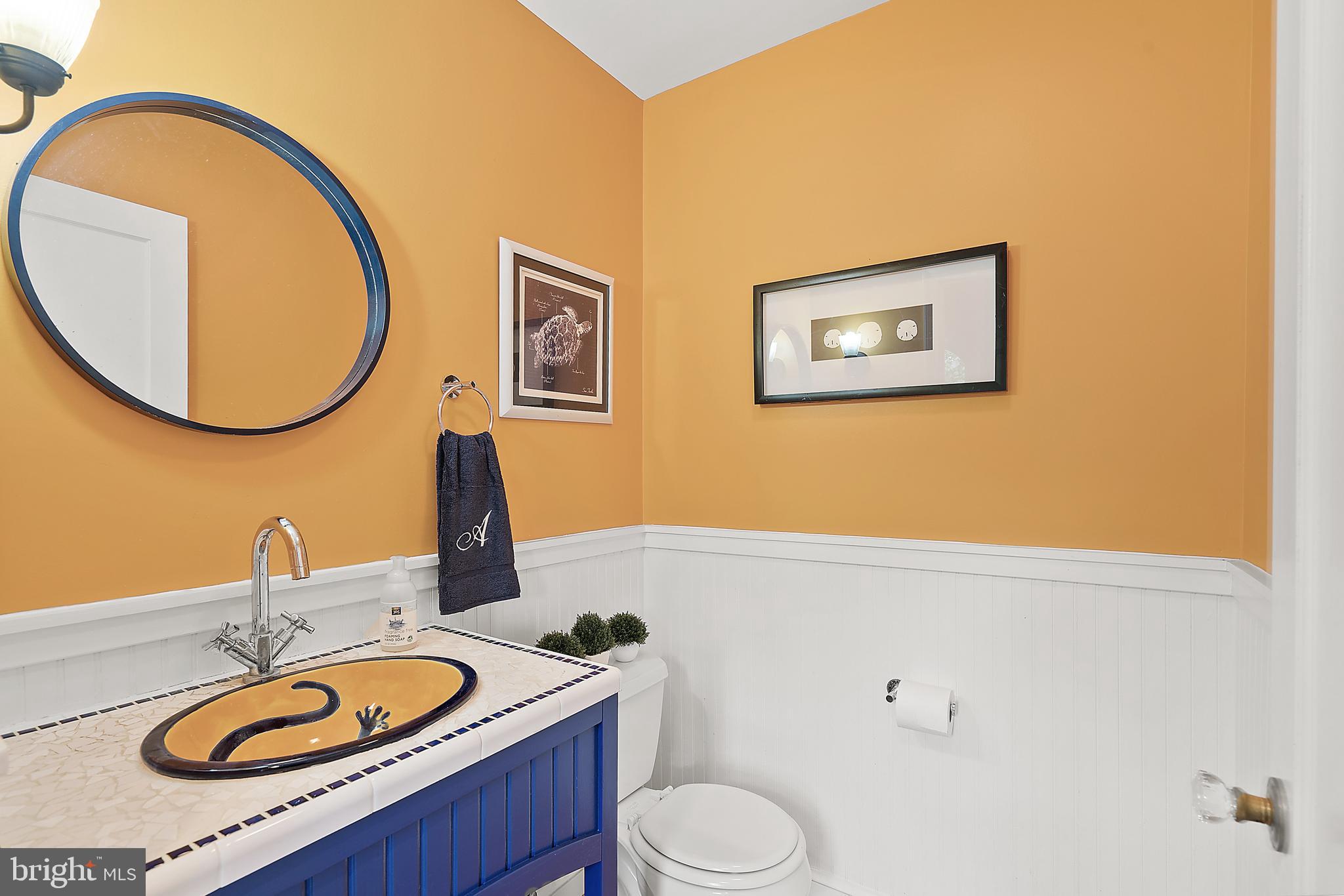 9100 Warren Street Silver Spring, MD 20910 - Photo 14 of 67 POWDER ROOM WITH UNIQUE SINK & WAINSCOTTING