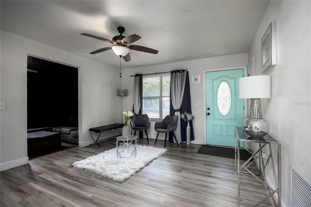 a living room with fireplace furniture and a flat screen tv