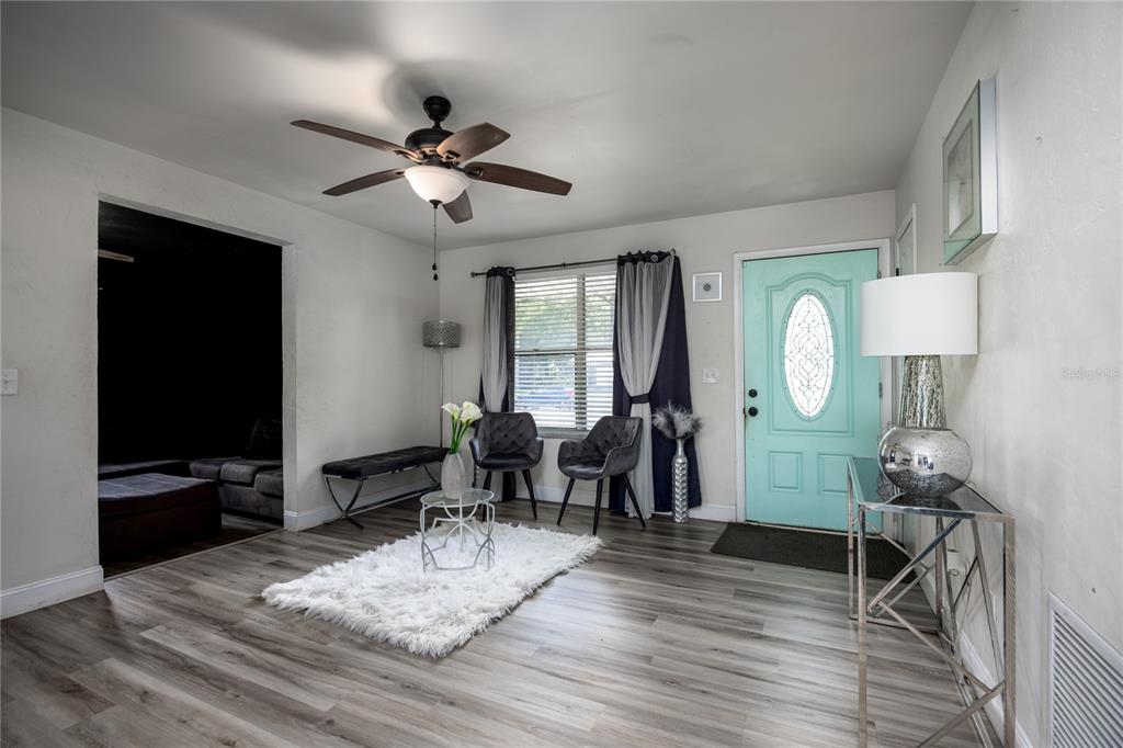 15872 Southwest 133rd Lane Archer, FL 32618 - Photo 14 of 28 a living room with fireplace furniture and a flat screen tv